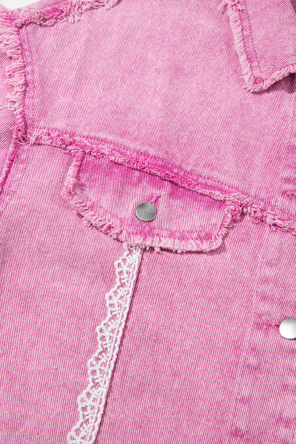 Close-up of pink denim fabric with lace trim